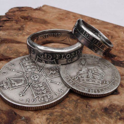 Handmade and recycled silver coin rings being sized in the workshop