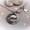 handmade and upcycled silver shilling dolphin necklace