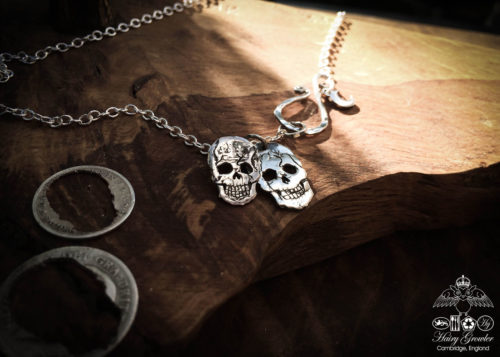 Handmade and upcycled silver sixpence coin skull necklace
