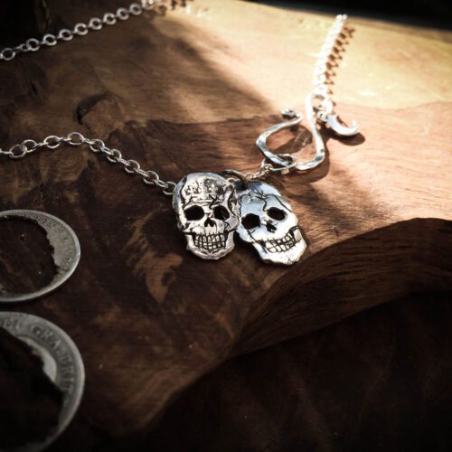 Handmade and upcycled silver sixpence coin skull necklace