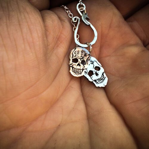Handmade and upcycled silver sixpence coin skull necklace