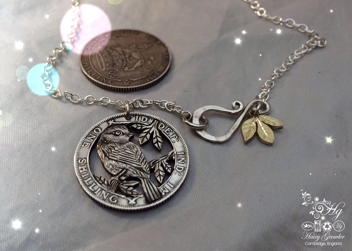 Hand made and repurposed silver shilling The Silver Shilling collection. silver blue-tit necklace totally handcrafted and recycled from old sterling silver shilling coins. Designed and created by Hairy Growler Jewellery, Cambridge, UK. necklace