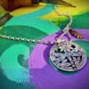dragonfly necklace pendant hand cut and carved from a recycled sterling silver shilling coin