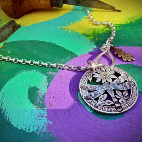 dragonfly necklace pendant hand cut and carved from a recycled sterling silver shilling coin