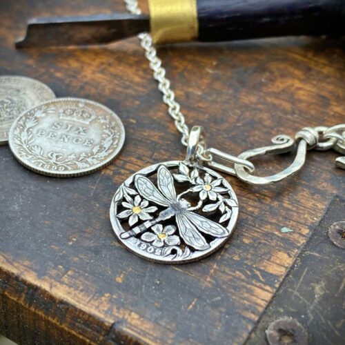 Dragonfly necklace Handmade and repurposed silver shilling The Silver sixpence collection. silver Dragonfly necklace totally handcrafted and recycled from old sterling silver sixpence coins. Designed and created by Hairy Growler Jewellery, Cambridge, UK. necklace