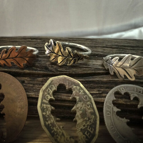 handcrafted and recycled bronze acorn and silver stacking rings