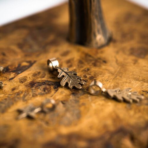 handmade and recycled bronze coin oak leaf charm for a tree sculpture, necklace or bracelet