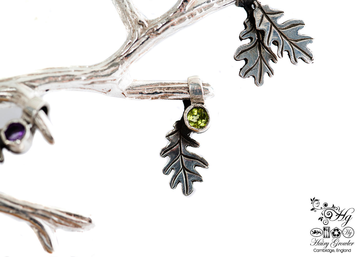 handcrafted silver and peridot oak leaf charm for a tree sculpture, necklace or bracelet