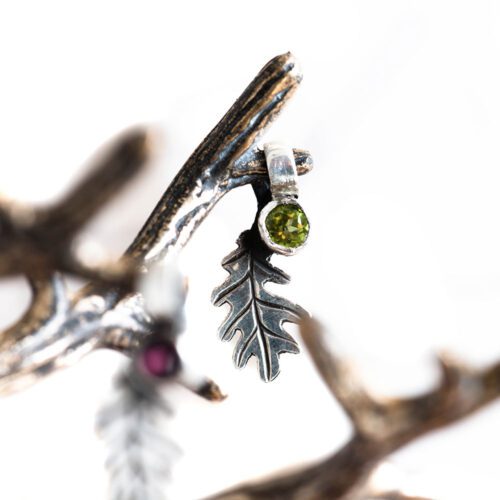 handcrafted silver and peridot and garnet oak leaf charm for a tree sculpture, necklace or bracelet