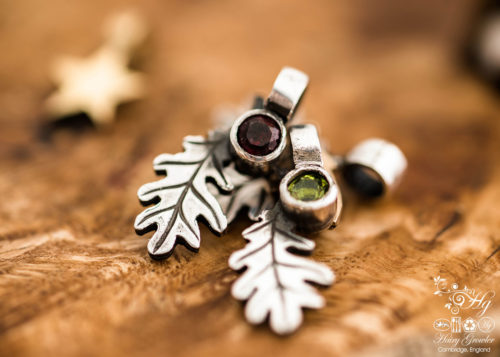 handcrafted silver and peridot and garnet oak leaf charm for a tree sculpture, necklace or bracelet