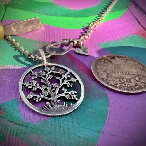 the hawthorn may tree handcrafted from a sterling silver shilling coin. Made in England