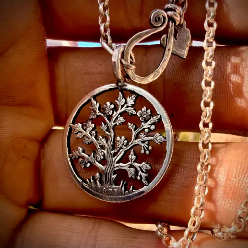 the hawthorn may tree handcrafted from a sterling silver shilling coin. Made in England