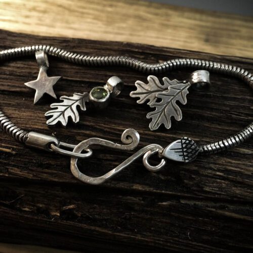 Silver charm bracelet handcrafted and recycled for the tree of life sculpture collection