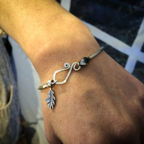 Silver charm bracelet handcrafted and recycled for the tree of life sculpture collection