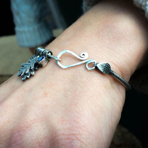 Silver charm bracelet handcrafted and recycled for the tree of life sculpture collection