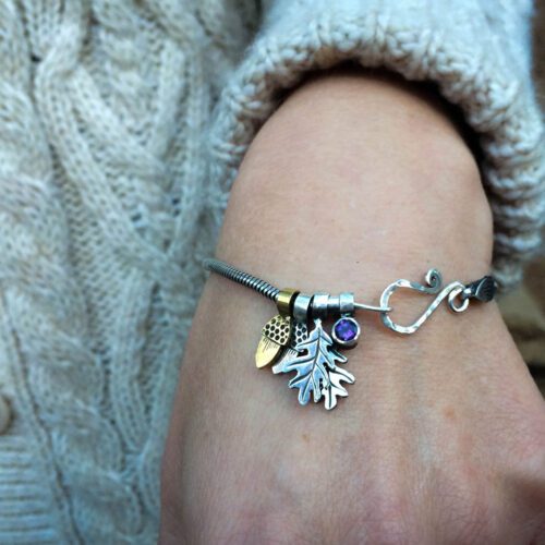 Silver charm bracelet handcrafted and recycled for the tree of life sculpture collection