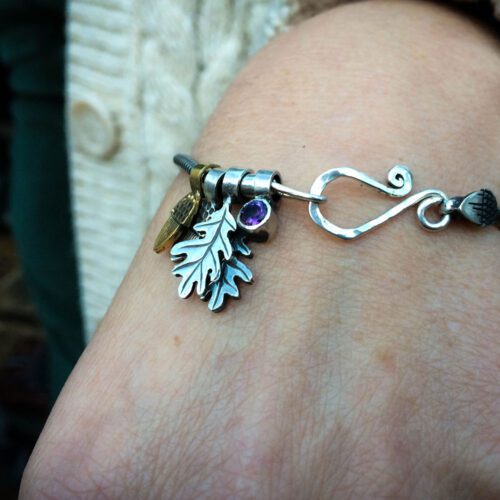 Silver charm bracelet handcrafted and recycled for the tree of life sculpture collection