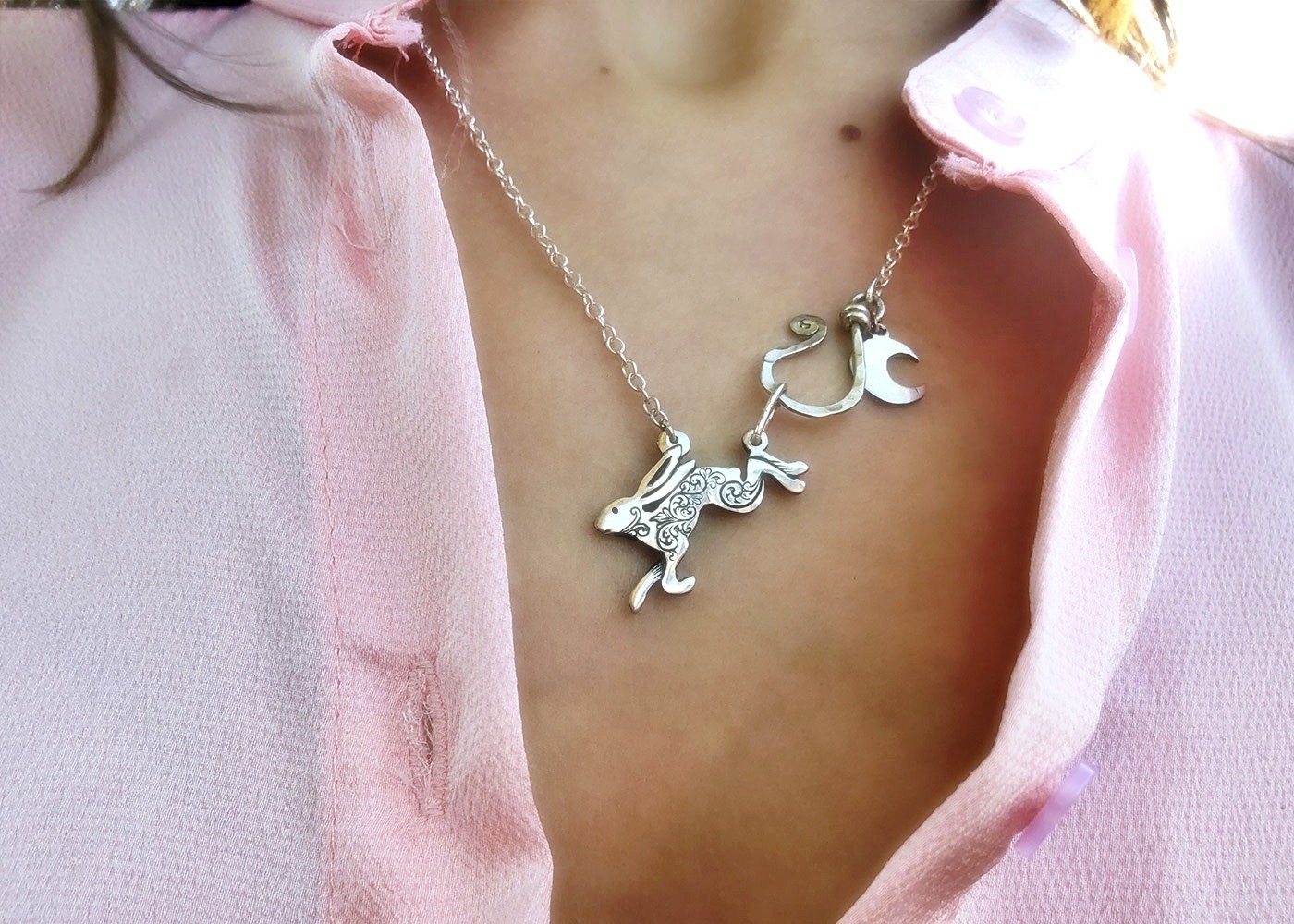 Leaping hare necklace handmade and recycled silver coin jewellery ethically handcrafted at an independant artisan studio workshop