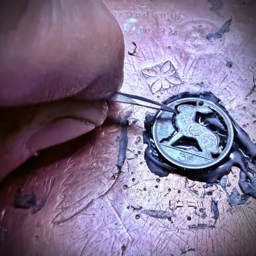 Irish hare coin - transformed with traditional hand tools and techniques.