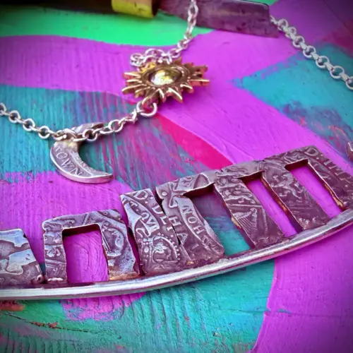 Stonehenge Celestial necklace a signature work by Hairy Growler, Cambridge. Made in England