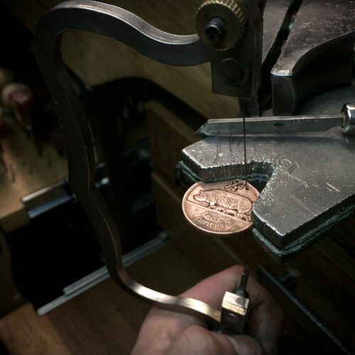 Hand-cut and carved with traditional flourish scrolls Irish pig half penny coin pendant