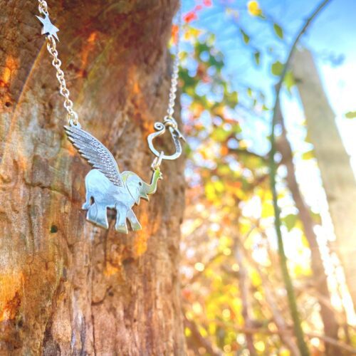 Handcrafted and recycled sterling silver flying-elephant necklace