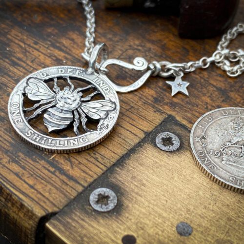 Handcrafted and upcycled silver shilling The Silver Shilling collection. silver Bee necklace totally handcrafted and recycled from old sterling silver shilling coins. Designed and created by Hairy Growler Jewellery, Cambridge, UK. necklace