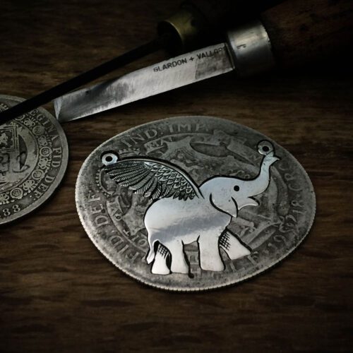 Handcrafted and recycled sterling silver flying-elephant necklace