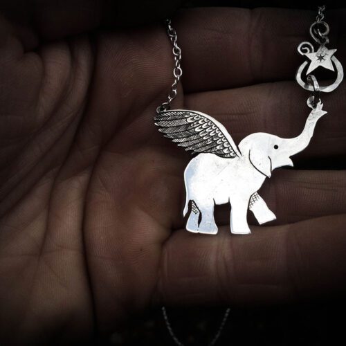 Handcrafted and recycled sterling silver flying-elephant necklace