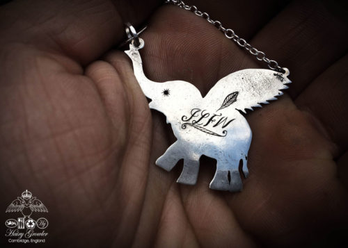 Handcrafted and recycled sterling silver flying-elephant necklace