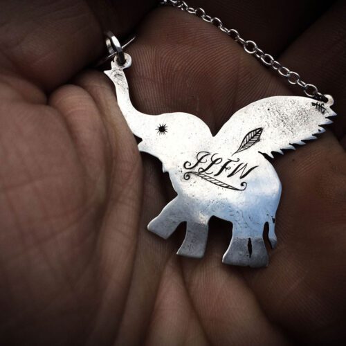 Handcrafted and recycled sterling silver flying-elephant necklace
