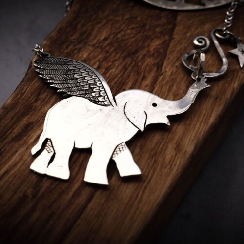 Handcrafted and recycled sterling silver flying-elephant necklace