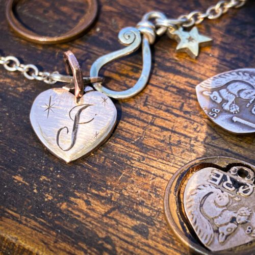 handmade copper squirrel heart charm for a tree sculpture, necklace or bracelet