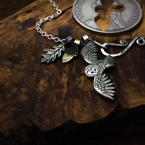 handmade and recycled silver coins flying playful owl charm for a tree sculpture, necklace or bracelet