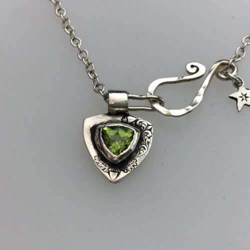 handcrafted silver and peridot family shield for a tree sculpture, necklace or bracelet