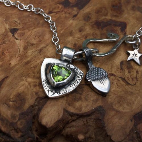 handcrafted silver and peridot family shield for a tree sculpture, necklace or bracelet