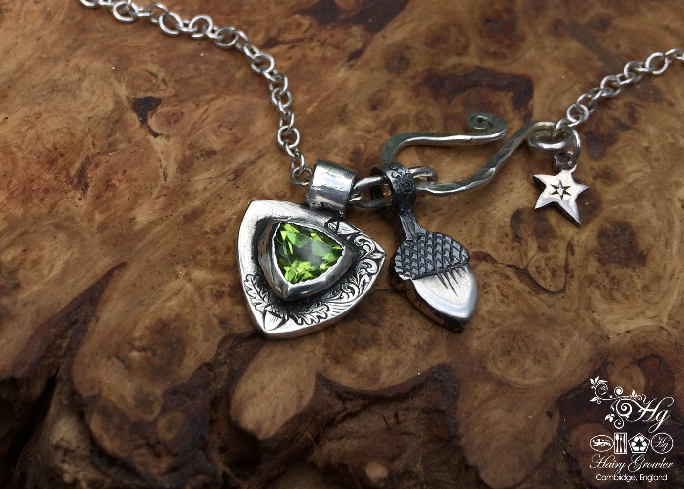 handcrafted silver and peridot family shield for a tree sculpture, necklace or bracelet