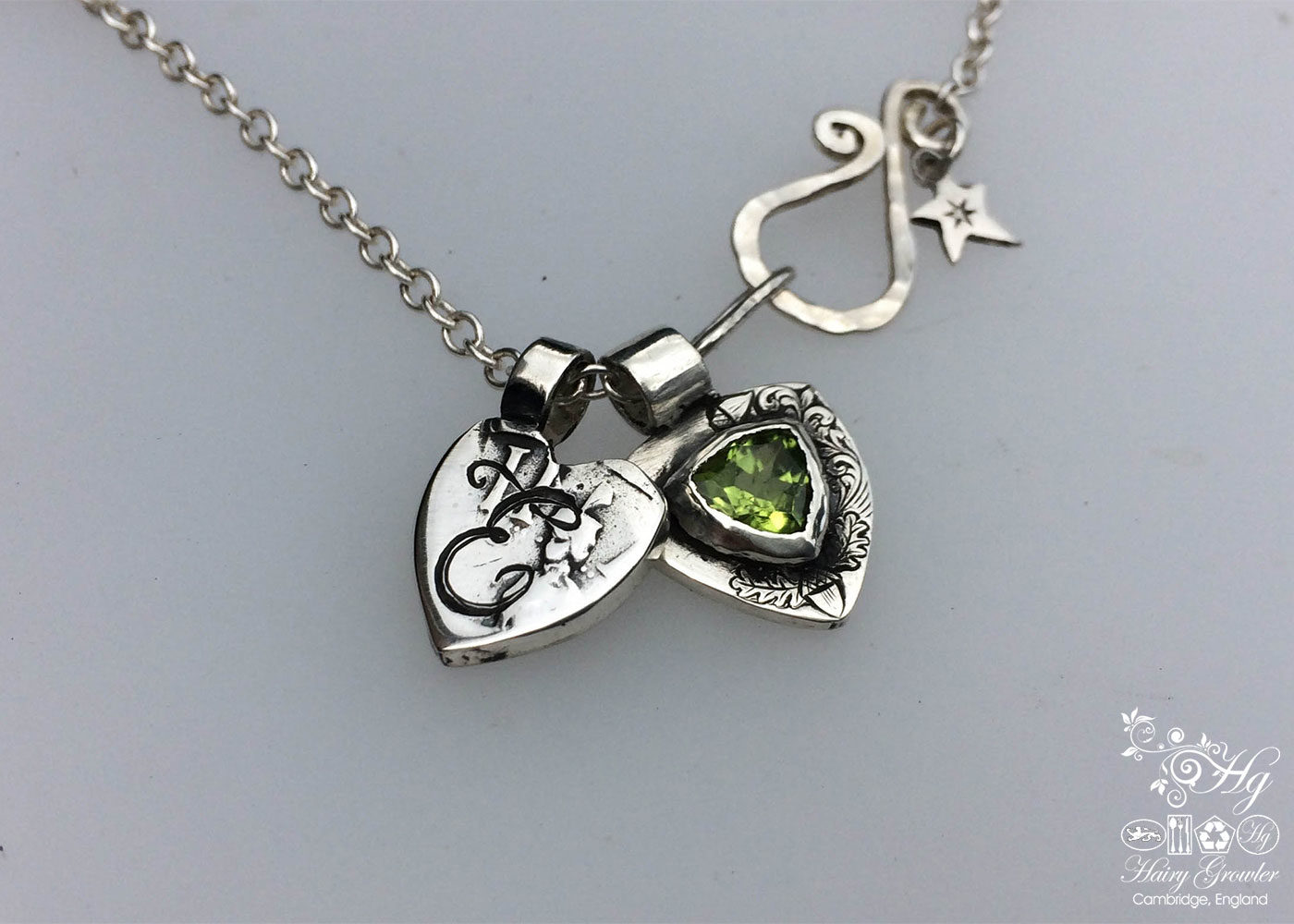 handcrafted silver and peridot family shield for a tree sculpture, necklace or bracelet