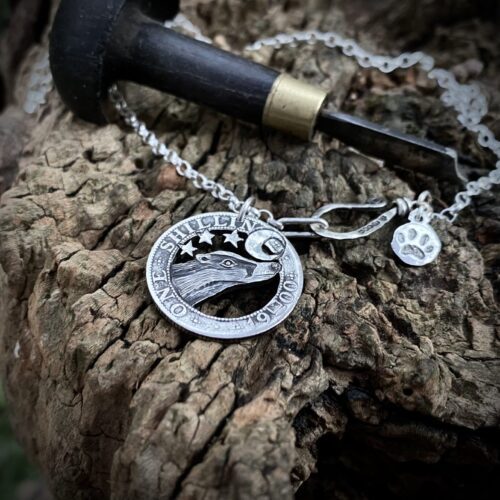 Handcrafted and recycled silver shilling The Silver Shilling collection. silver badger necklace totally handcrafted and recycled from old sterling silver shilling coins. Designed and created by Hairy Growler Jewellery, Cambridge, UK. necklace