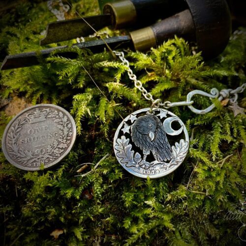 Handmade and repurposed silver shilling curious raven necklace totally handcrafted and recycled from old sterling silver shilling coins. Designed and created by Hairy Growler Jewellery, Cambridge, UK