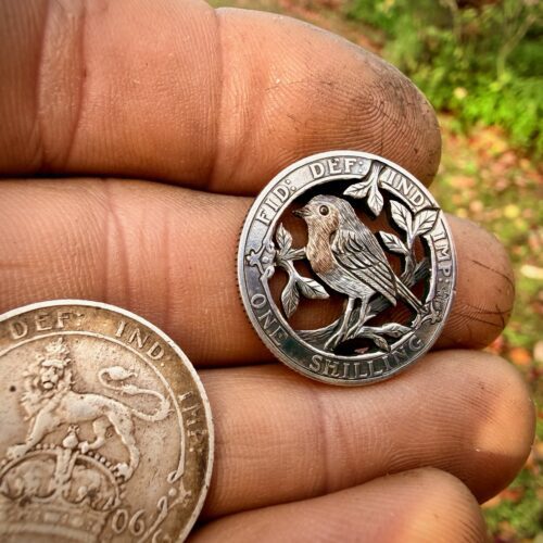 Handmade and completely upcycled and repurposed silver shilling robin red breast necklace pendant