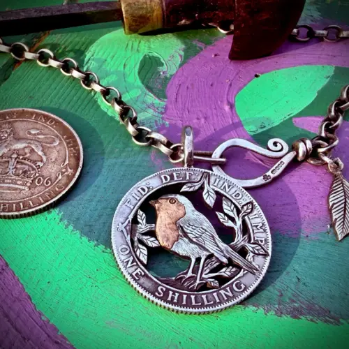 Handmade and completely upcycled and repurposed silver shilling robin red breast necklace pendant