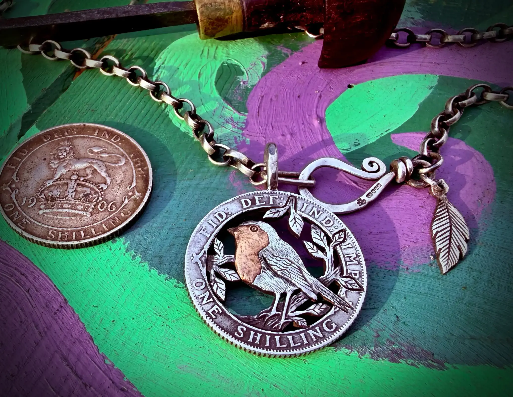 Handmade and completely upcycled and repurposed silver shilling robin red breast necklace pendant