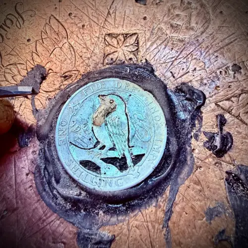Handmade and completely upcycled and repurposed silver shilling robin red breast necklace pendant