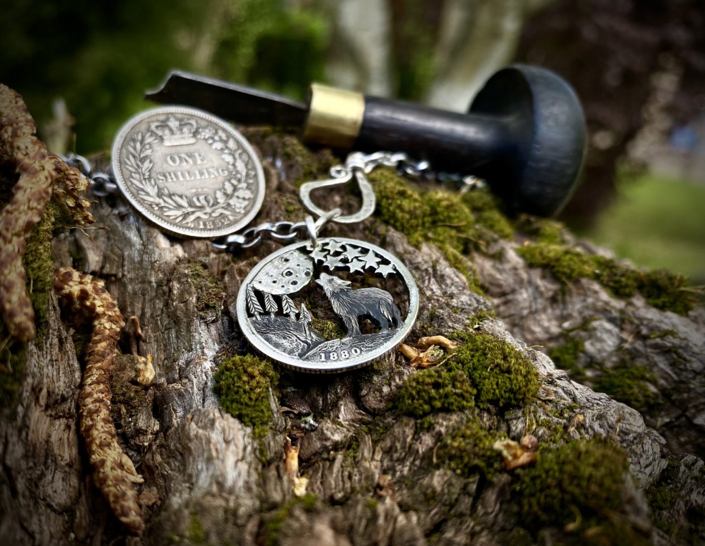 Handcrafted and recycled silver shilling The Silver Shilling collection. silver wolves necklace totally handcrafted and recycled from old sterling silver shilling coins. Designed and created by Hairy Growler Jewellery, Cambridge, UK. necklace