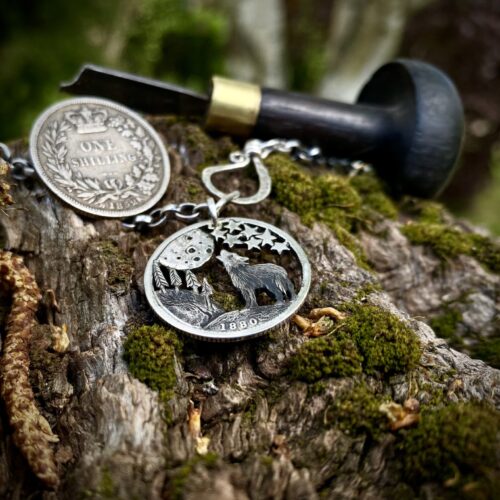 Handcrafted and recycled silver shilling The Silver Shilling collection. silver wolves necklace totally handcrafted and recycled from old sterling silver shilling coins. Designed and created by Hairy Growler Jewellery, Cambridge, UK. necklace