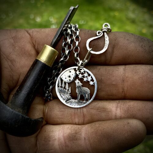 Handcrafted and recycled silver shilling The Silver Shilling collection. silver wolves necklace totally handcrafted and recycled from old sterling silver shilling coins. Designed and created by Hairy Growler Jewellery, Cambridge, UK. necklace