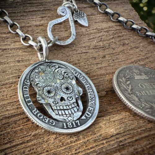 Handmade and upcycled silver shilling coin day-of-the-dead skull necklace