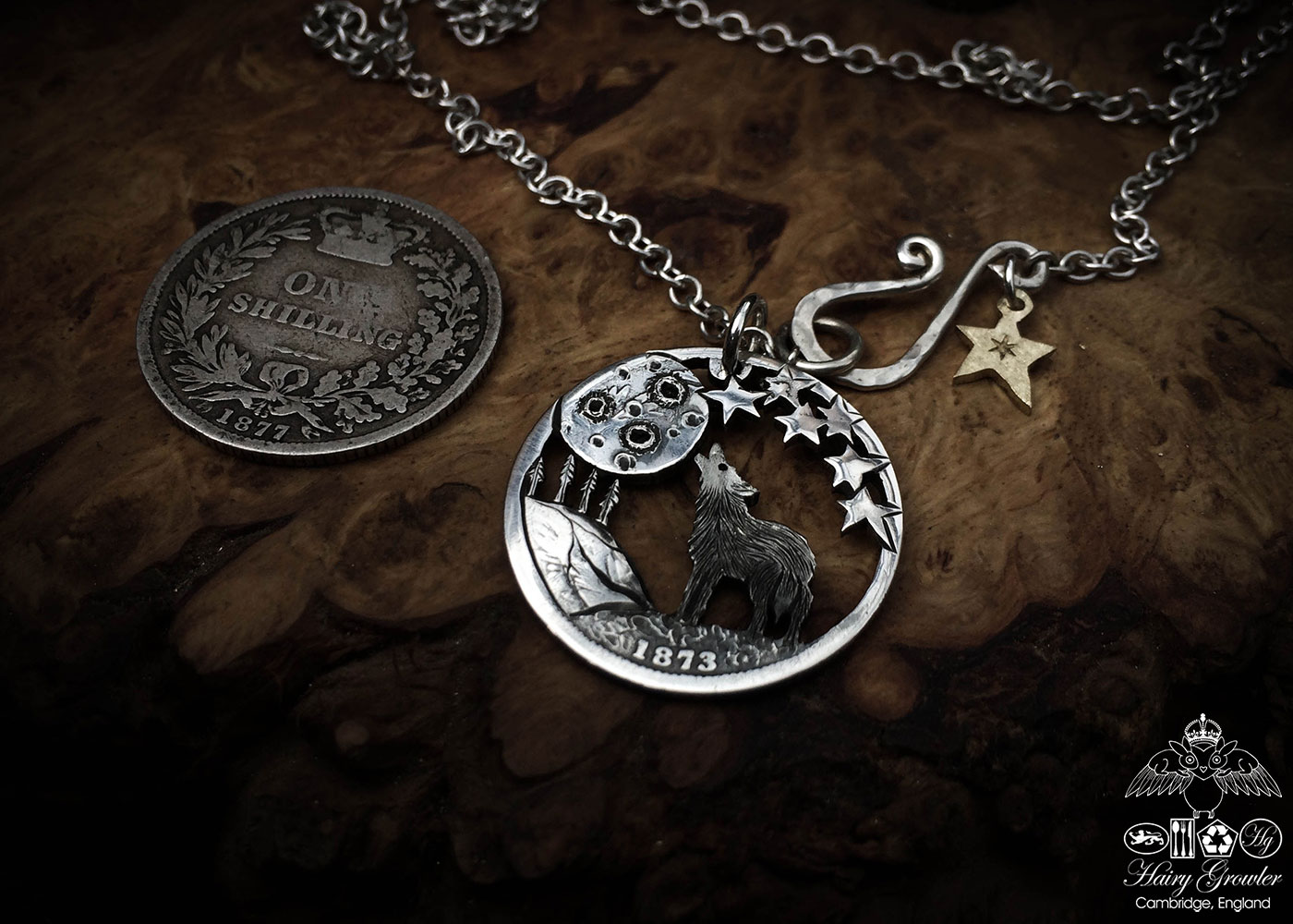 Handcrafted and recycled silver shilling The Silver Shilling collection. silver wolf necklace totally handcrafted and recycled from old sterling silver shilling coins. Designed and created by Hairy Growler Jewellery, Cambridge, UK. necklace