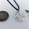 handcrafted and recycled silver shilling snowflake necklace